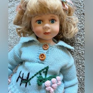 Porcelain Doll w/ Stand. 19” tall, by Milestone. Look at those aweet blue eyes!